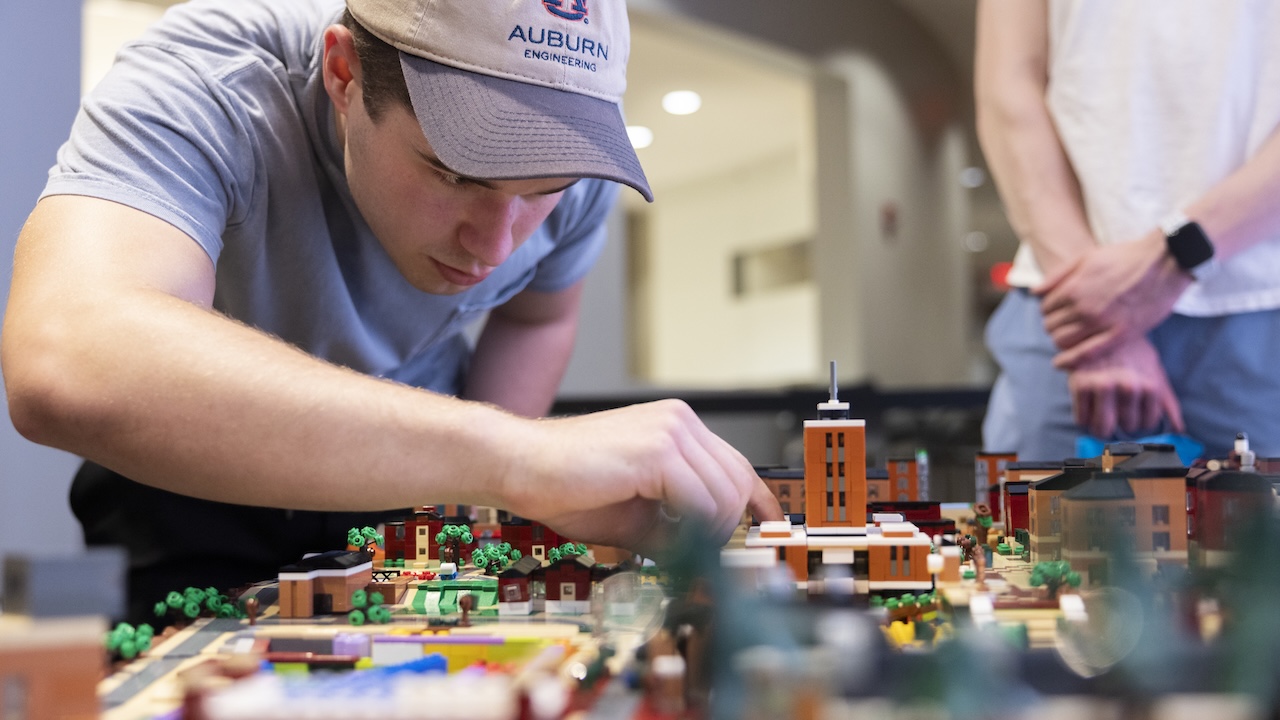 Jack Lawson makes an addition to his lego model of Auburn's campus