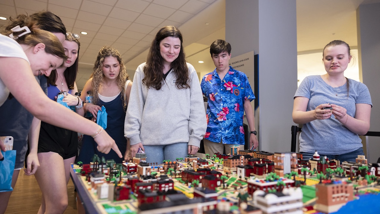 students study the Lego model of the Auburn campus at Lego Night