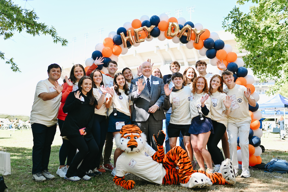 aubie posing with members of SGA and president Roberts