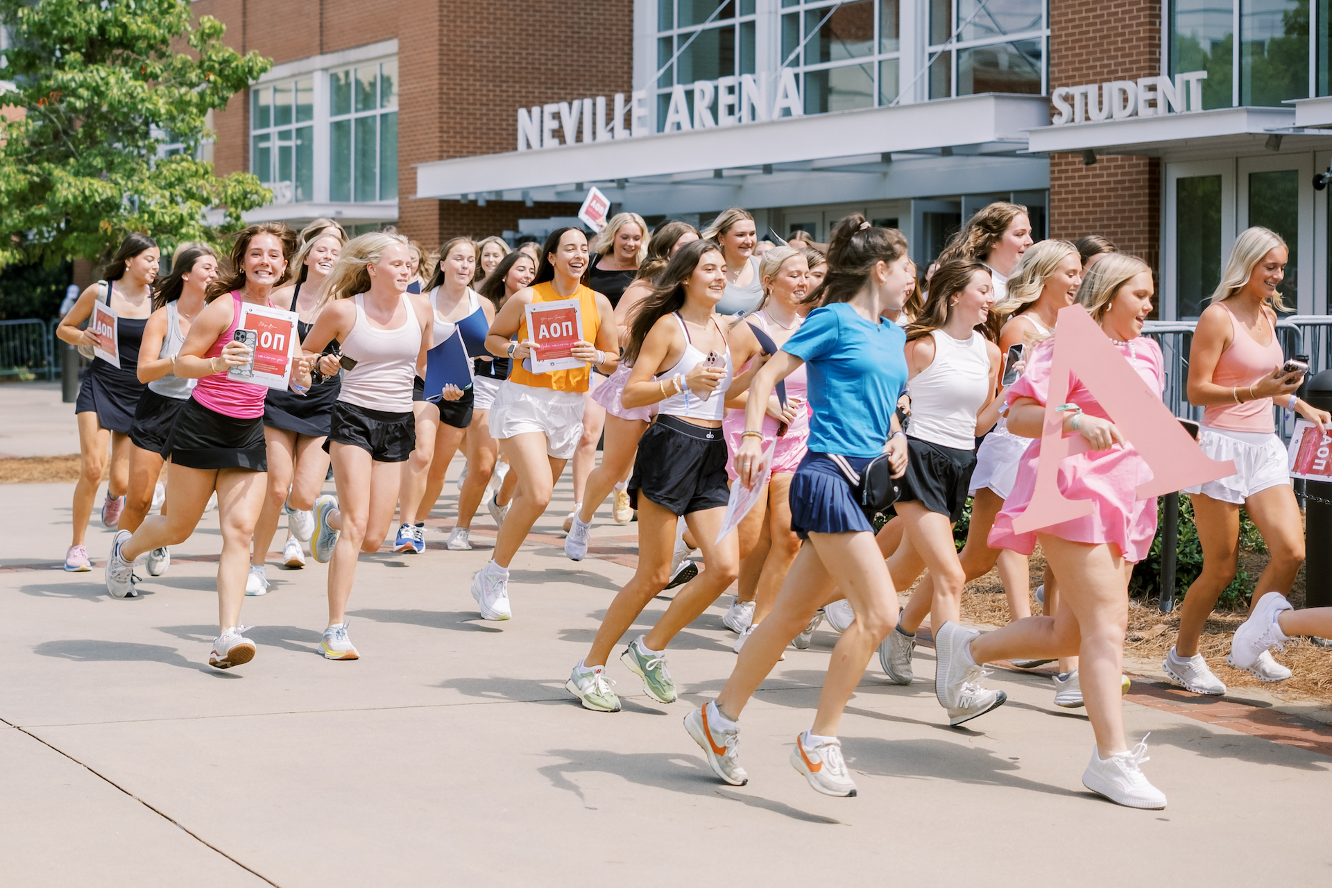sorority students running out of Neville arena on bid day