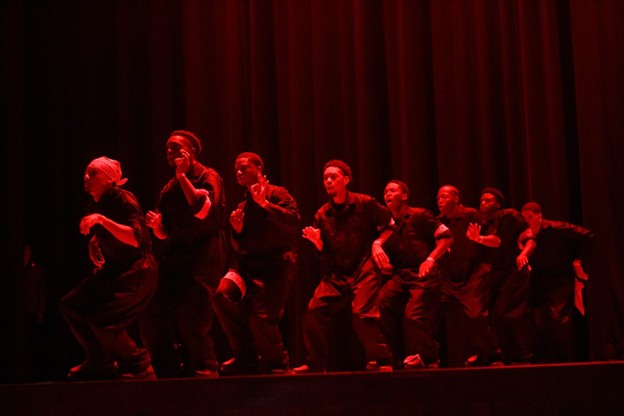 Students performing on stage.