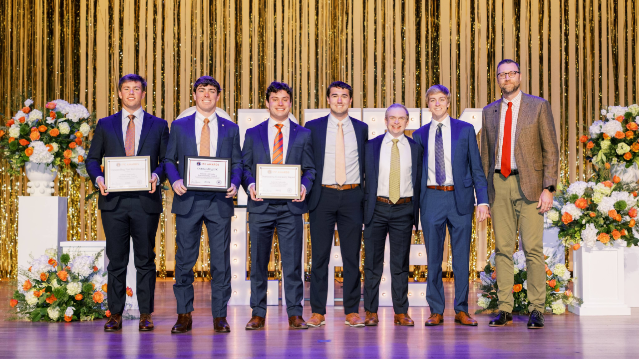 2026 Auburn IFC executive board accepting their recognition from Russell Best, COO of the NIC