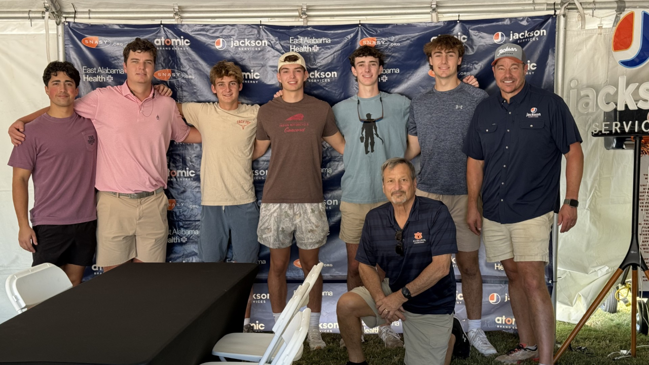 TKE brothers serving at the Special Needs Assistance Station for You (SNASY) tent on gameday.