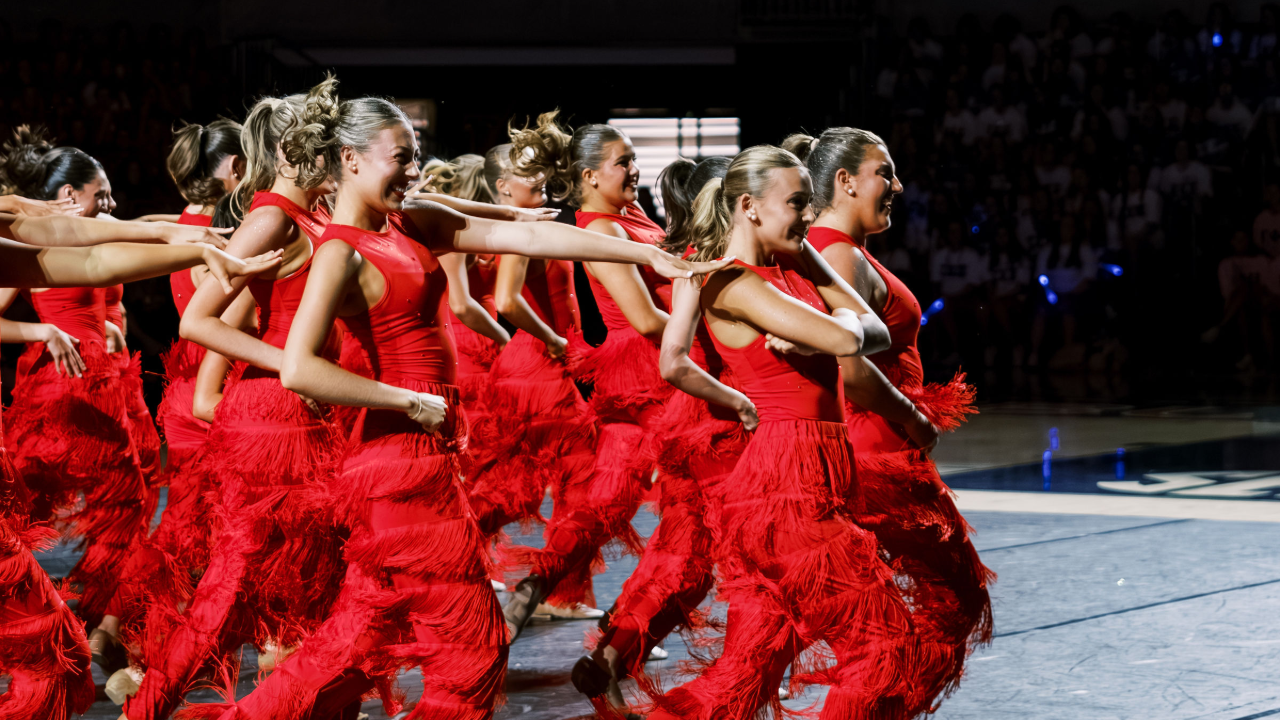 Women dancing in fringe pants.