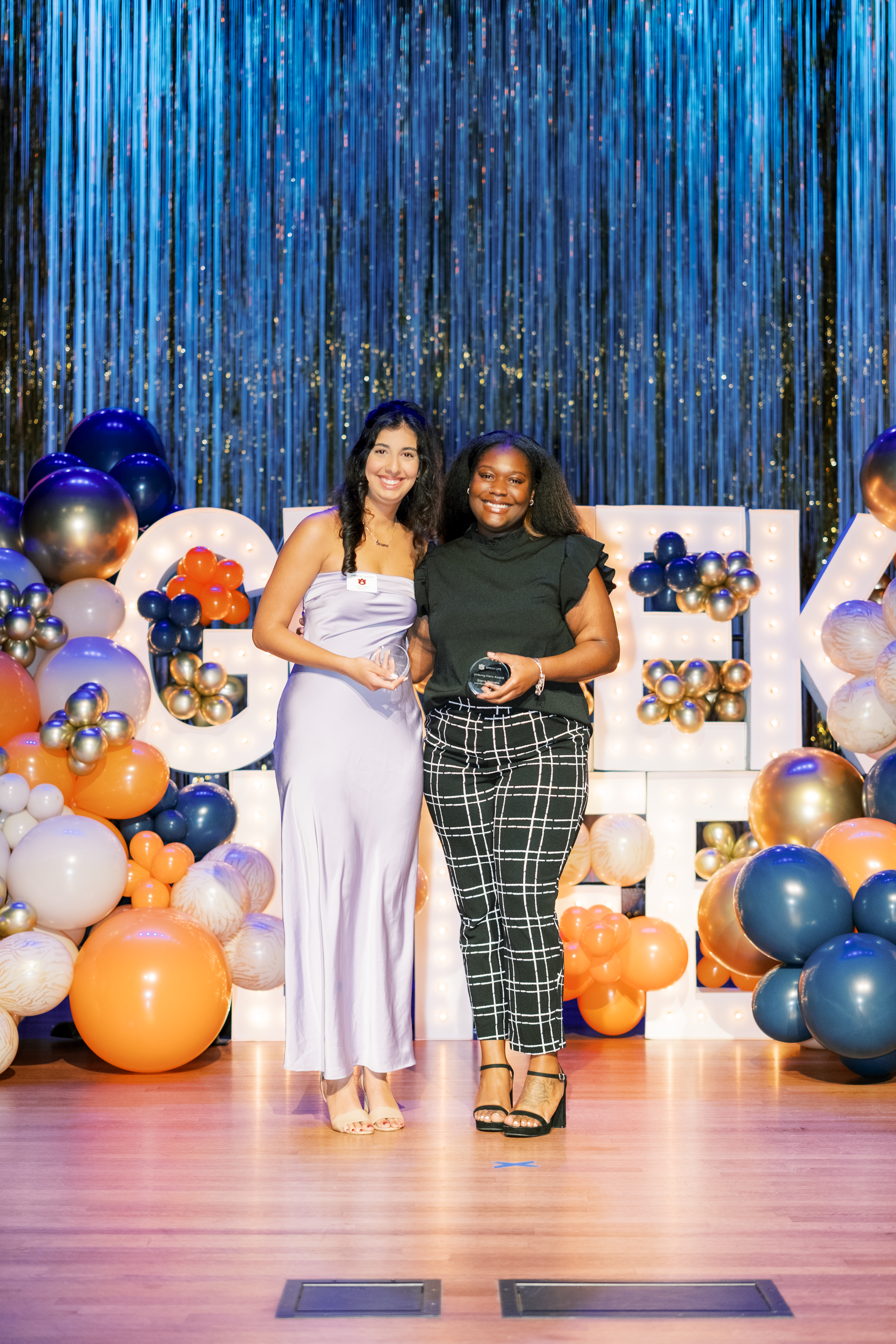 Students posing with awards