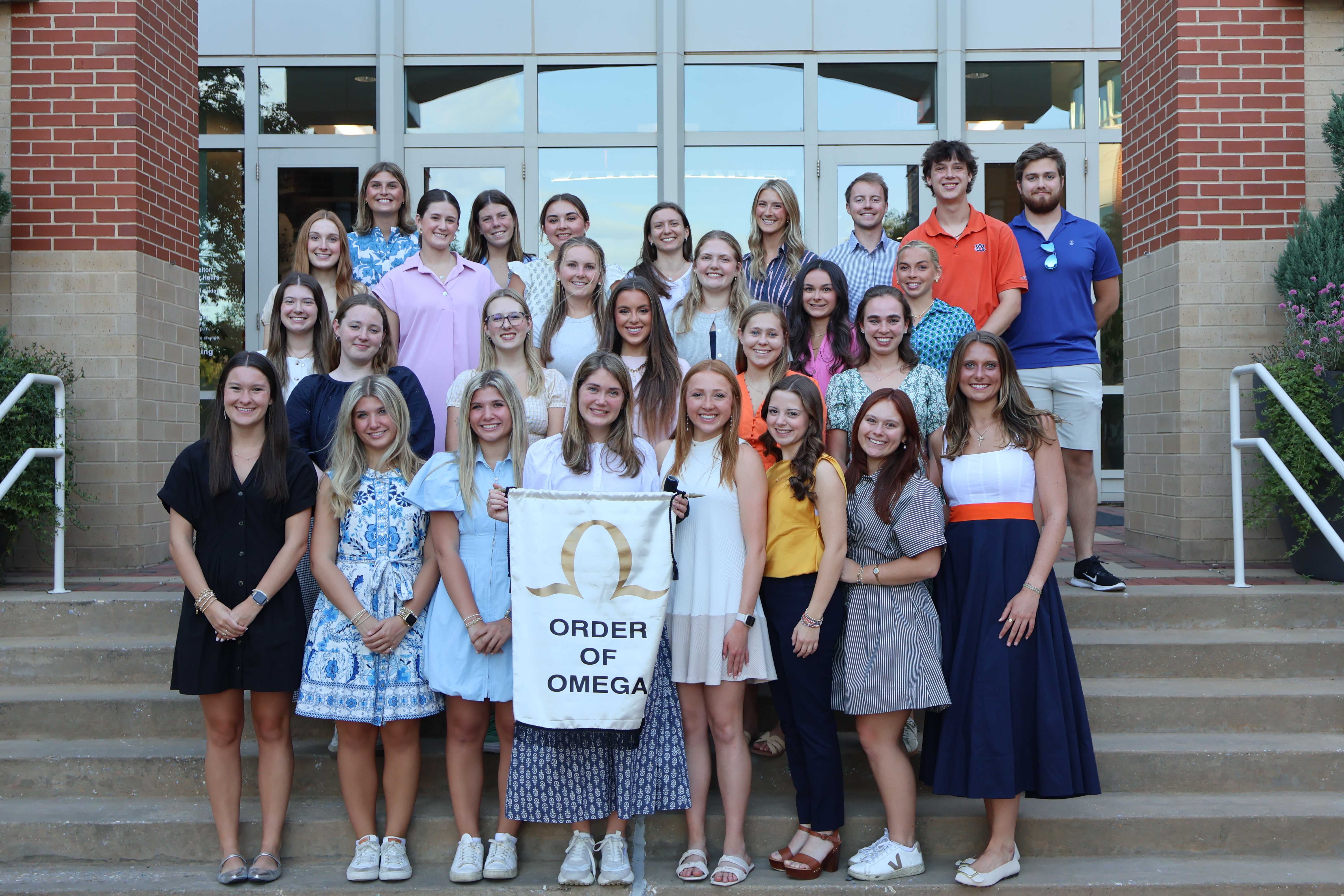 order of omega group photo