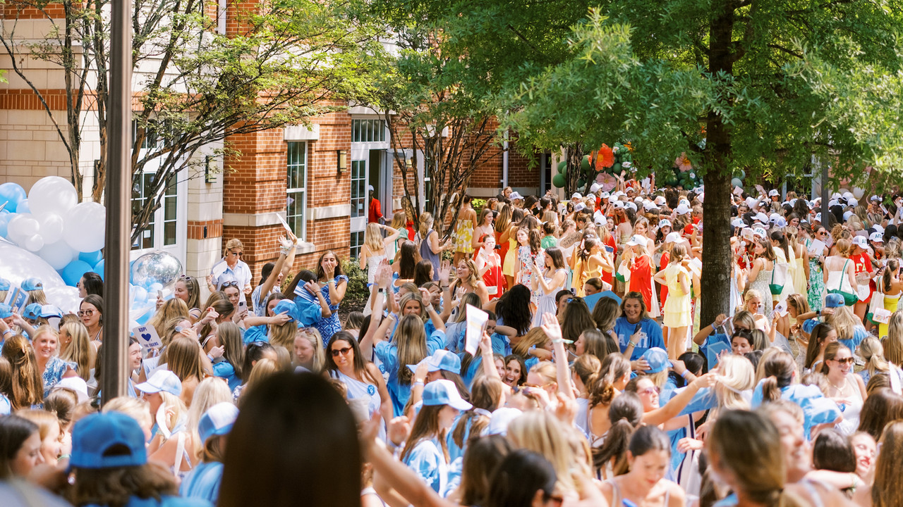 sorority students gather outside Neville arena for bid day