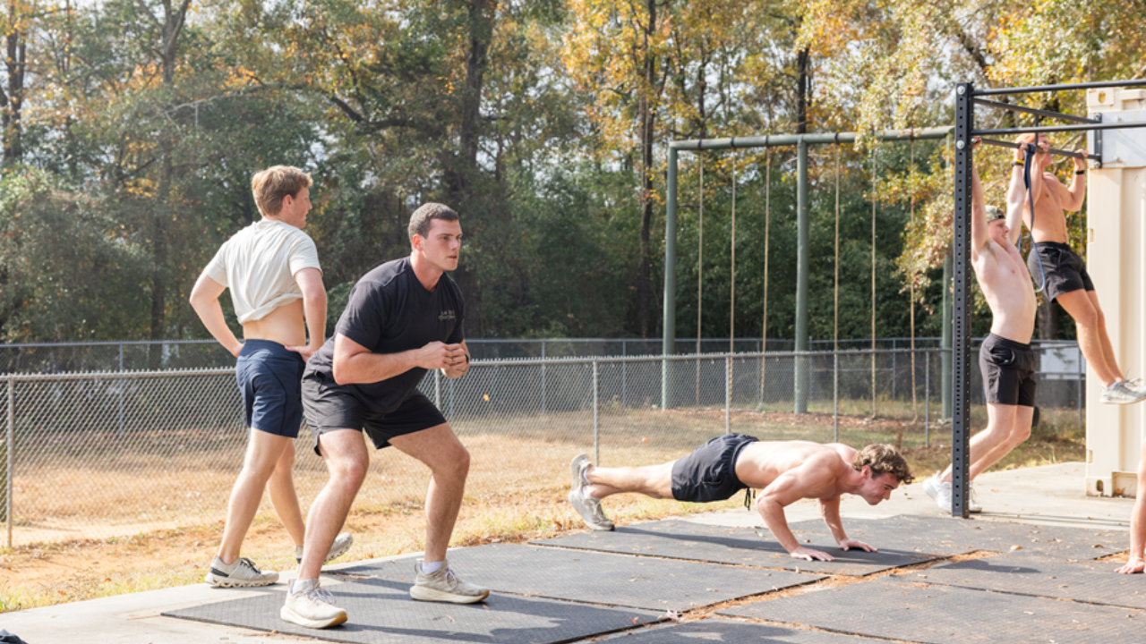 Men working out outdoors.