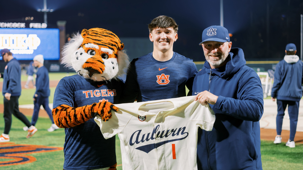 Two people smiling at the camera.