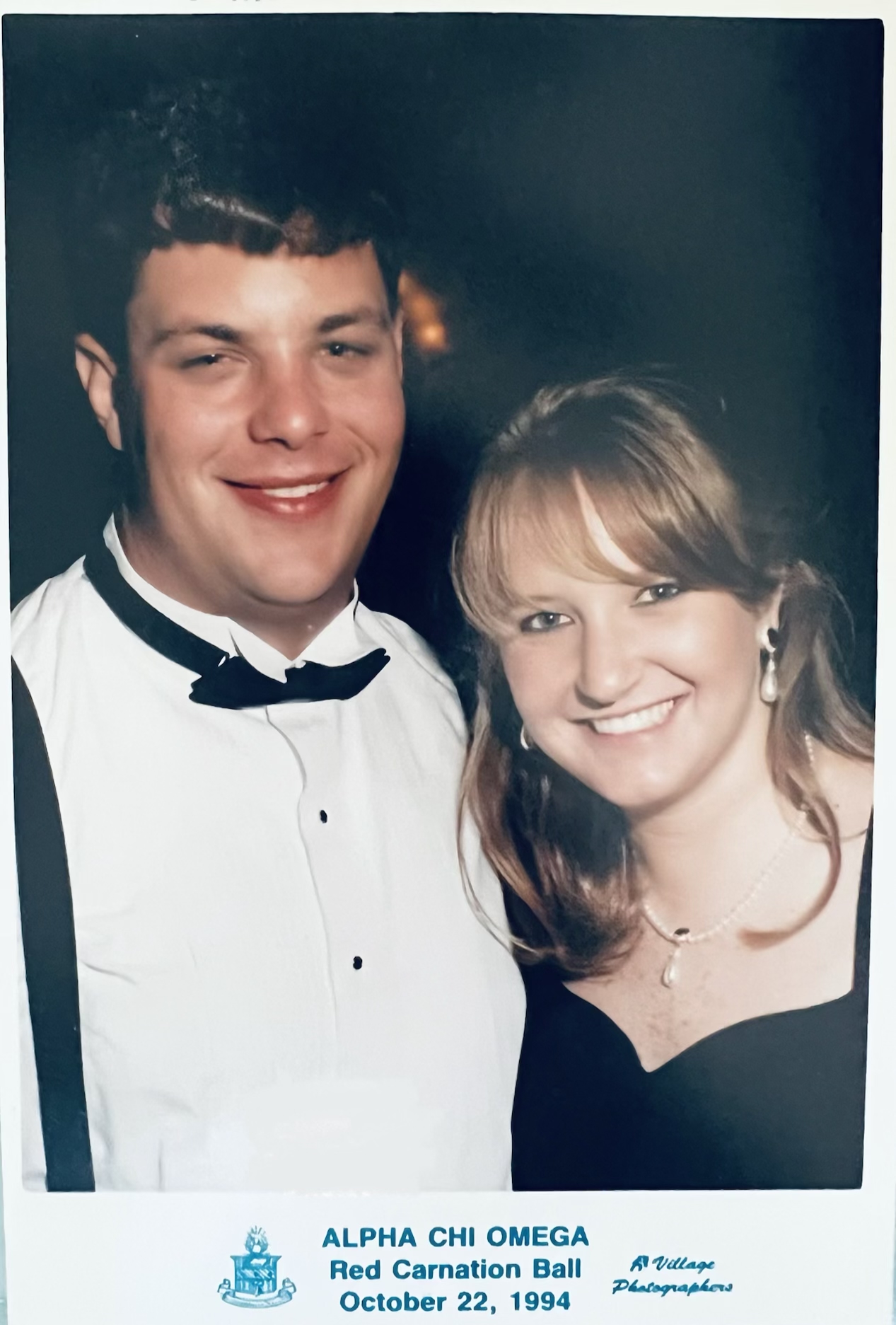 Two people smiling at the camera.