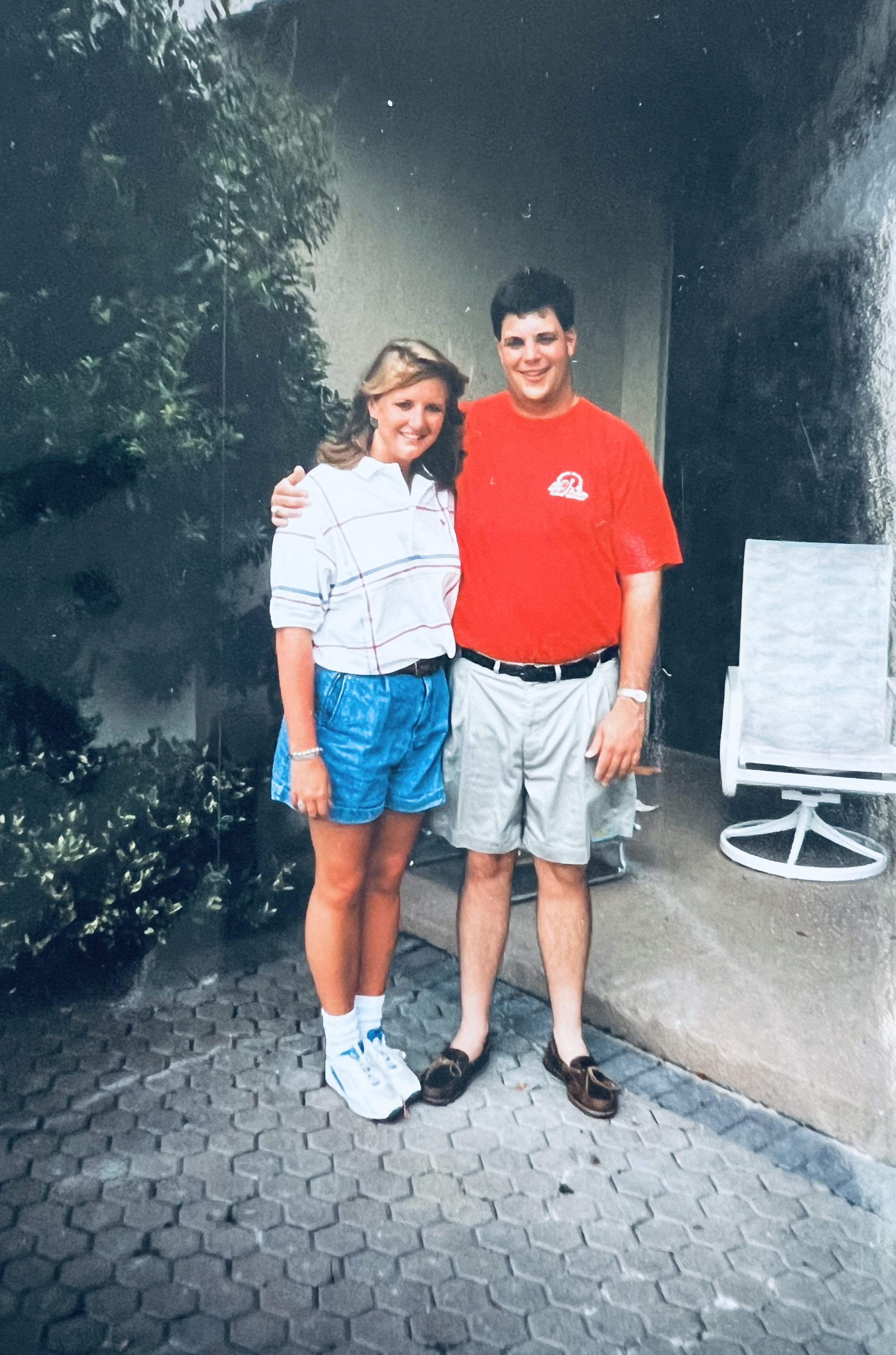 Two people smiling at the camera.