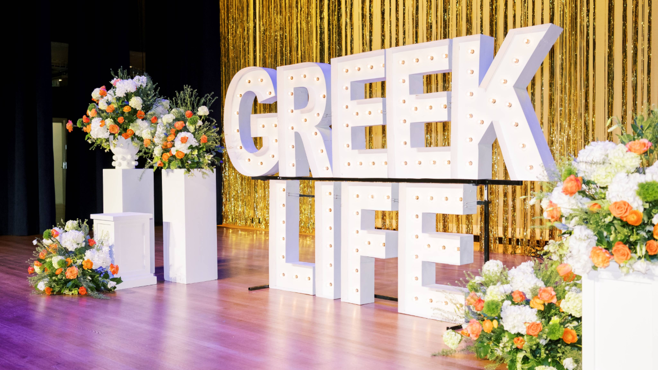 Stacked marquee letters with floral arrangements