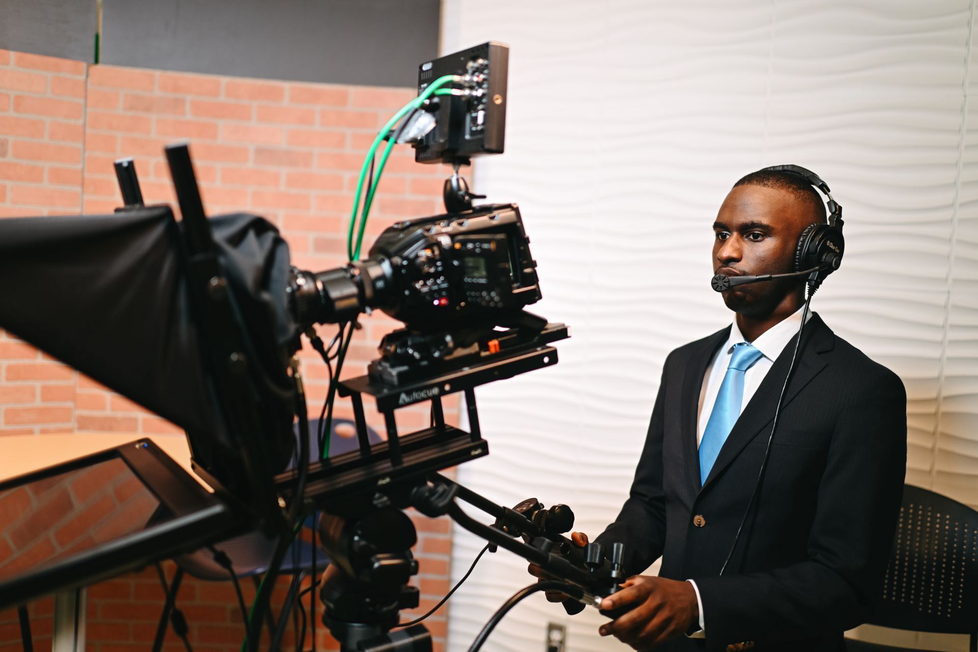 a student operating a camera during an Eagle Eye broadcast