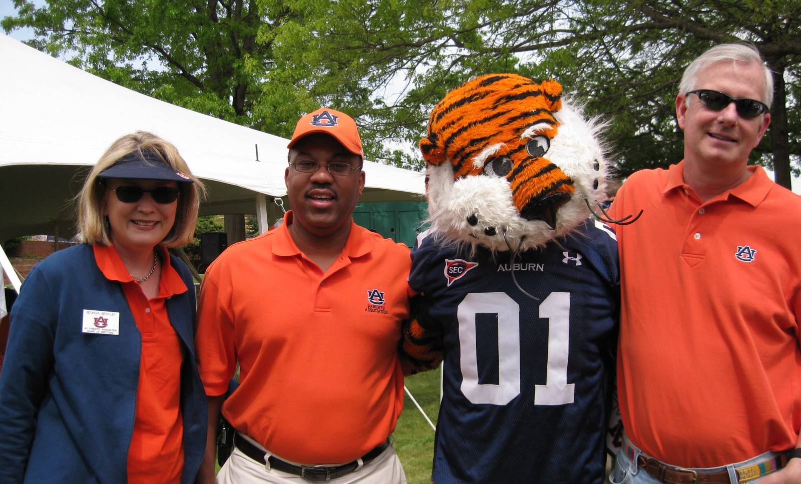 Parents posing with Aubie at a spring event in 2009