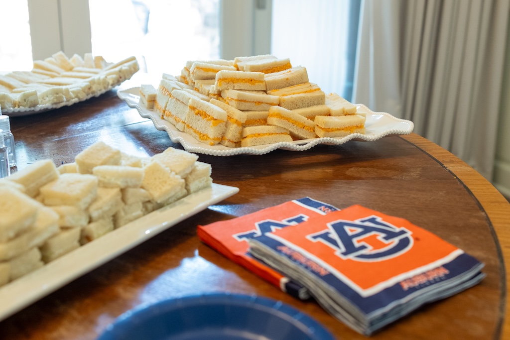 small sandwiches on plates with auburn napkins