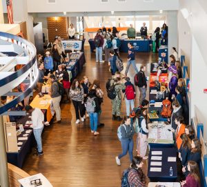 overhead view of the second floor of the student center with organizations at tables for the involvement fair