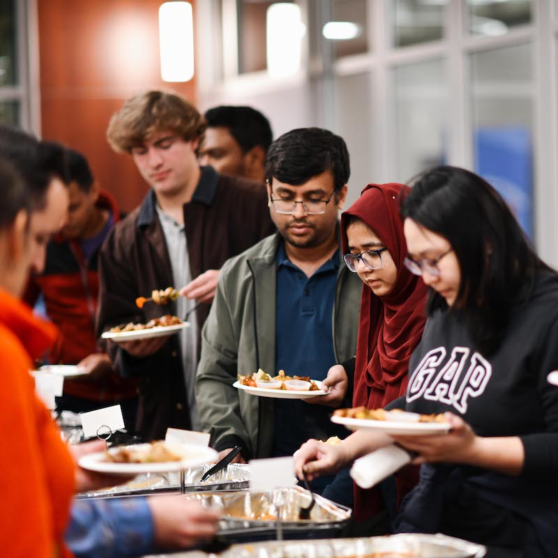 Students in a buffet line getting food