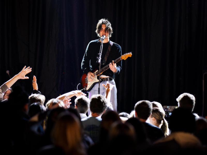 musician performing on stage at a Tiger Nights concert