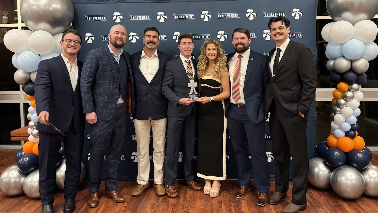 ASVA members pose with the Fred & Charlene Kam "Human Touch" Service award